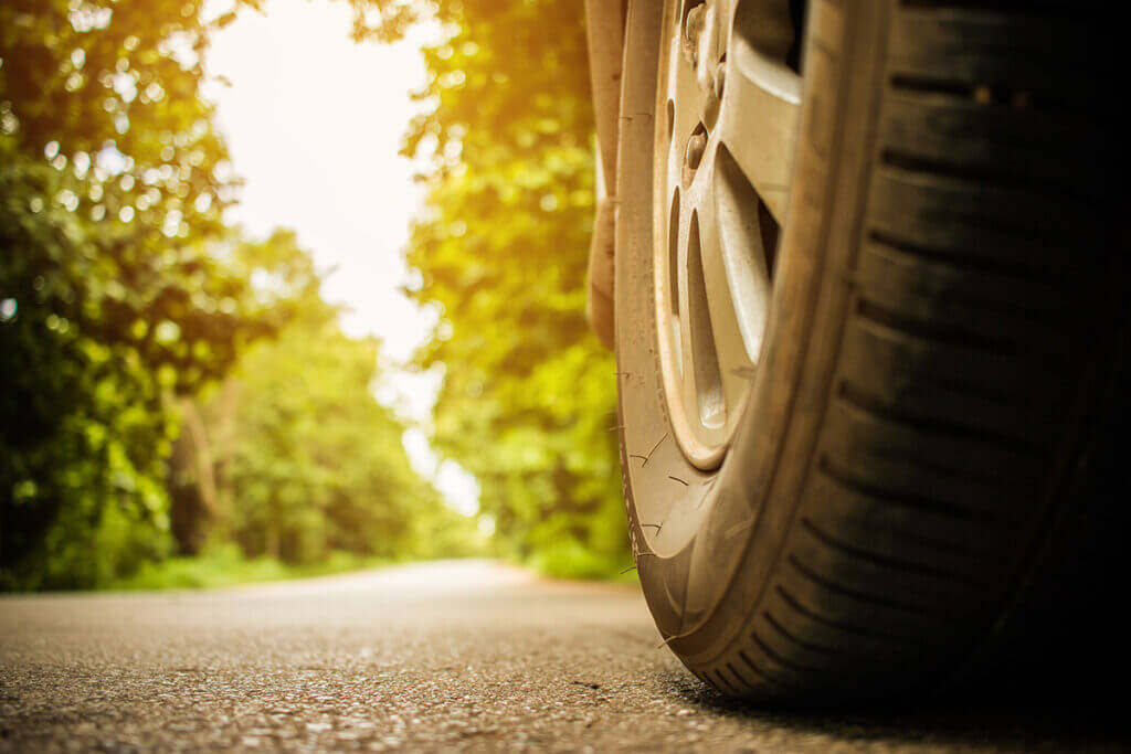 Tire of a car driving on road